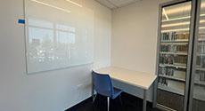 Photo of Study Room D with table, chair, and dry erase board