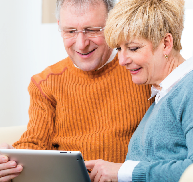 Computers and wifi feature card showing older couple on a tablet