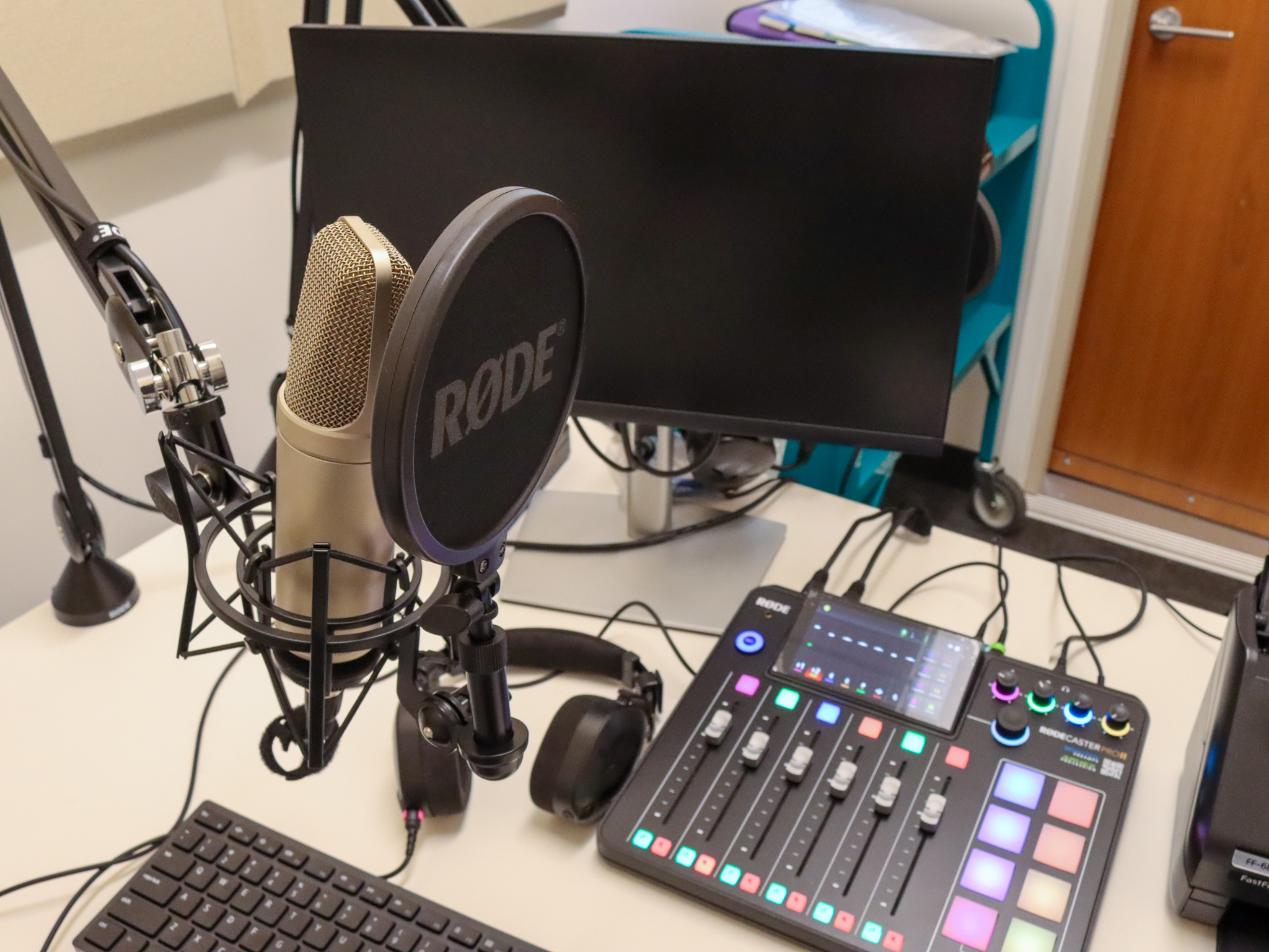 Recording equipment with microphone and mixing board in the Recording Lab