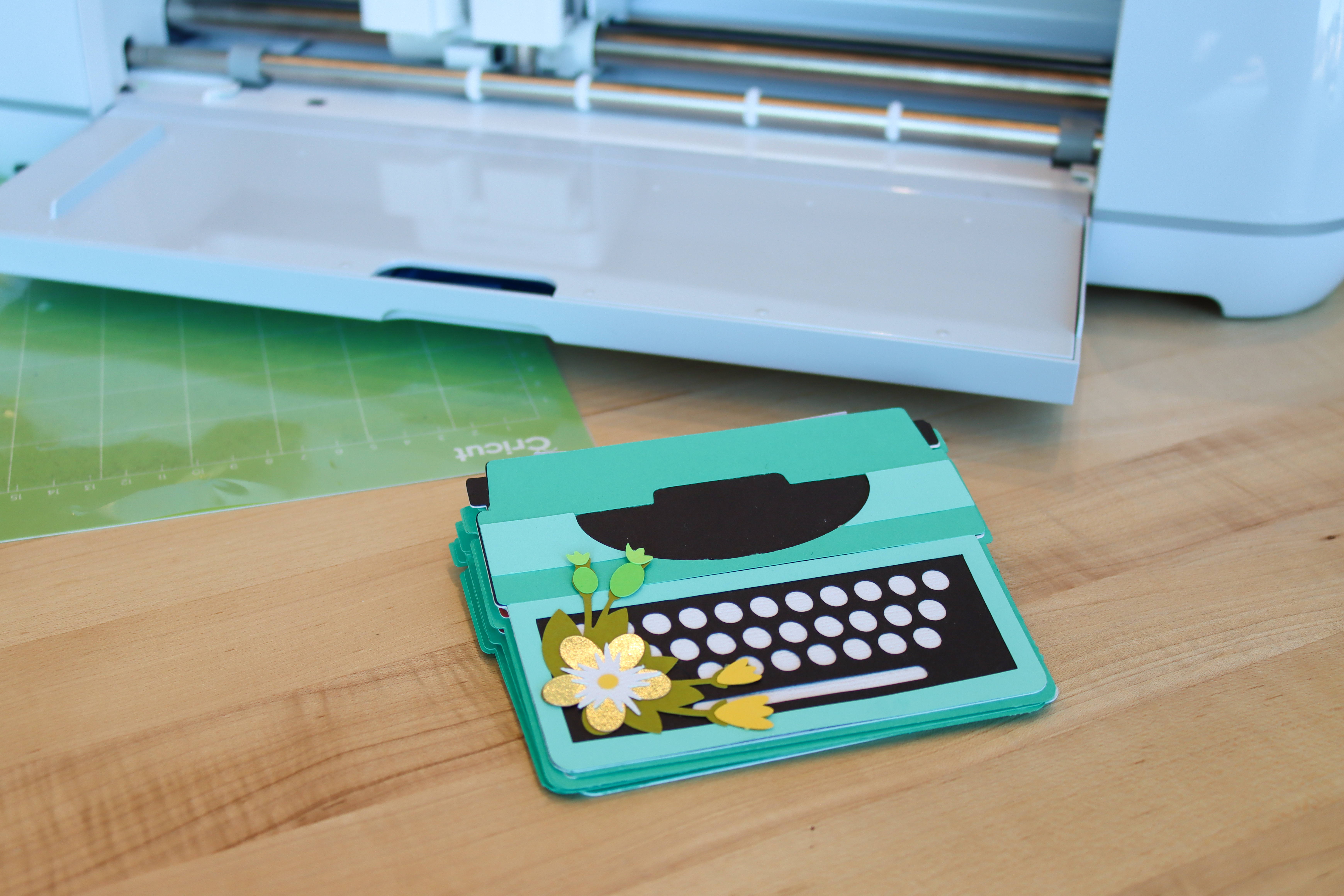 Mini paper scrapbook album in the shape of a typewriter