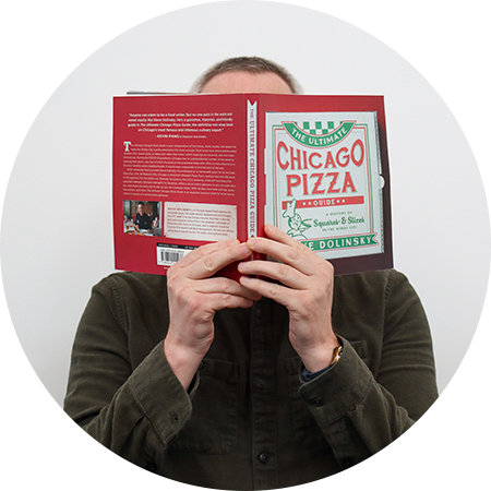 Tyler Works Headshot with Book