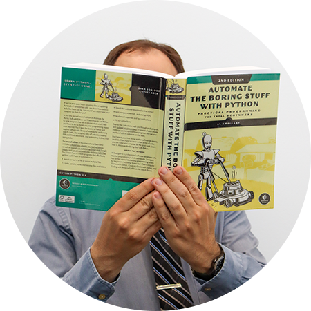 Alex Vancina Headshot with Book