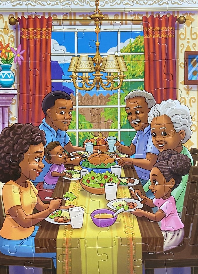 Family sitting around table with dinner