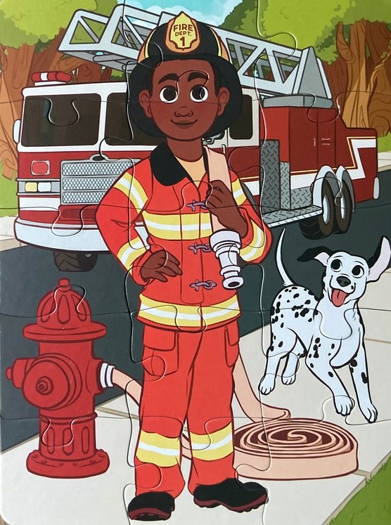 Firefighter standing in front of truck with Dog