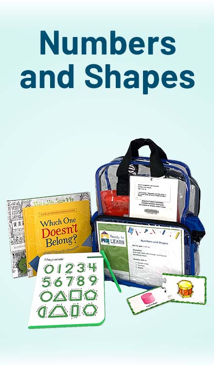 Clear backpack with books and manipulatives around it. 