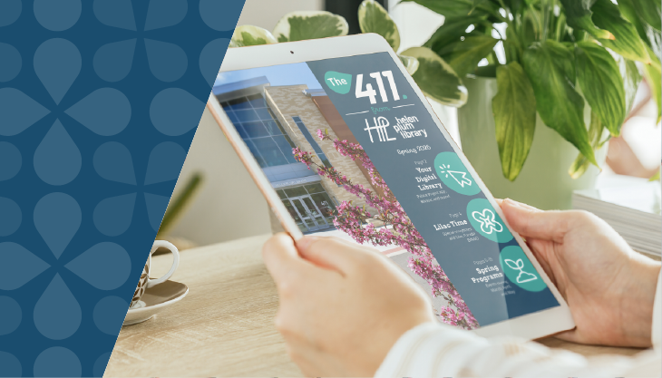 Hands holding a tablet showing the spring newsletter on the screen.