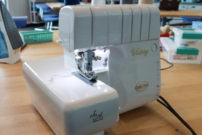 Baby Lock Victory Serger machine on a table in Studio 411